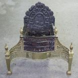 A George III style fire grate, the back decorated putti,