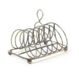 A George III silver toast rack, SA London 1807, with seven loop divisions, 16.