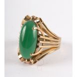 A chrysoprase ring, the oval stone in a stylised 14ct yellow gold setting,
