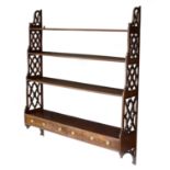 A George III mahogany hanging wall shelf,