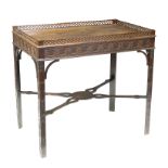 A George II style mahogany silver table, with galleried top above blind fret carved legs,