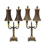 A pair of gilt metal and painted wood twin-branch table lights,