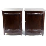 A pair of mahogany bowfront cupboards, enclosed by panel doors,