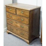 A George III oak chest of three long and two short drawers, on ogee bracket feet,