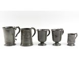 A 19th Century pewter mug, 15cm high, a pair of pewter mugs,