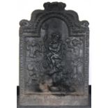 A cast iron fire back depicting Neptune,