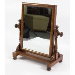 A Victorian mahogany swing frame mirror, on turned supports,