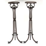 A pair of Chippendale style mahogany torchères,