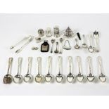 A set of ten Victorian silver teaspoons, Francis Higgins, London 1885, the matching sugar tongs,