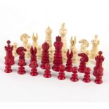 A 19th Century Indian carved ivory chess set, one white rook missing,