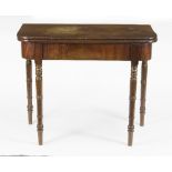 A 19th Century mahogany tea table on turned legs,