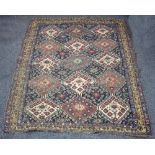 A Qashqai rug with diamond medallions within a multi-field border,