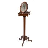 A Victorian mahogany shaving stand, with mirror above a drawer on hexagonal column and tripod base,