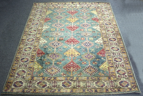 A Kazak rug worked in blue, brown and red,