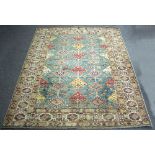 A Kazak rug worked in blue, brown and red,