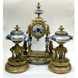 A Sèvres style clock garniture, the clock supported on four columns and flanked by putti, 41cm high,