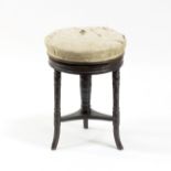A 19th Century circular rosewood piano stool,