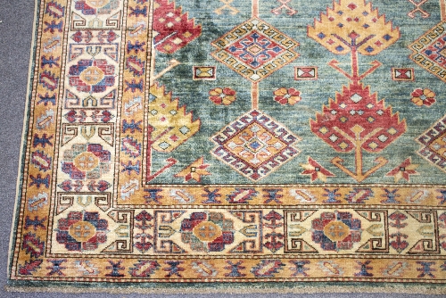 A Kazak rug worked in blue, brown and red, - Bild 2 aus 4