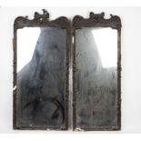 A near pair of mirrors, each with moulded scrolling plaster decoration to the frame (losses),