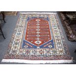 A Turkey rug, the central medallion on a blue ground within a multiple border,