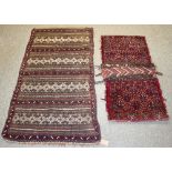 An Afghan flatweave mat with bands of geometric decoration,
