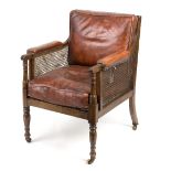 A Regency style bergère chair, with cane back,