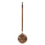 A 19th Century pierced copper warming pan with turned fruitwood handle,