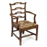 A George III style open armchair,