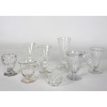 Four 18th Century glasses with wrythen or fluted bowls, various sizes, a custard cup,