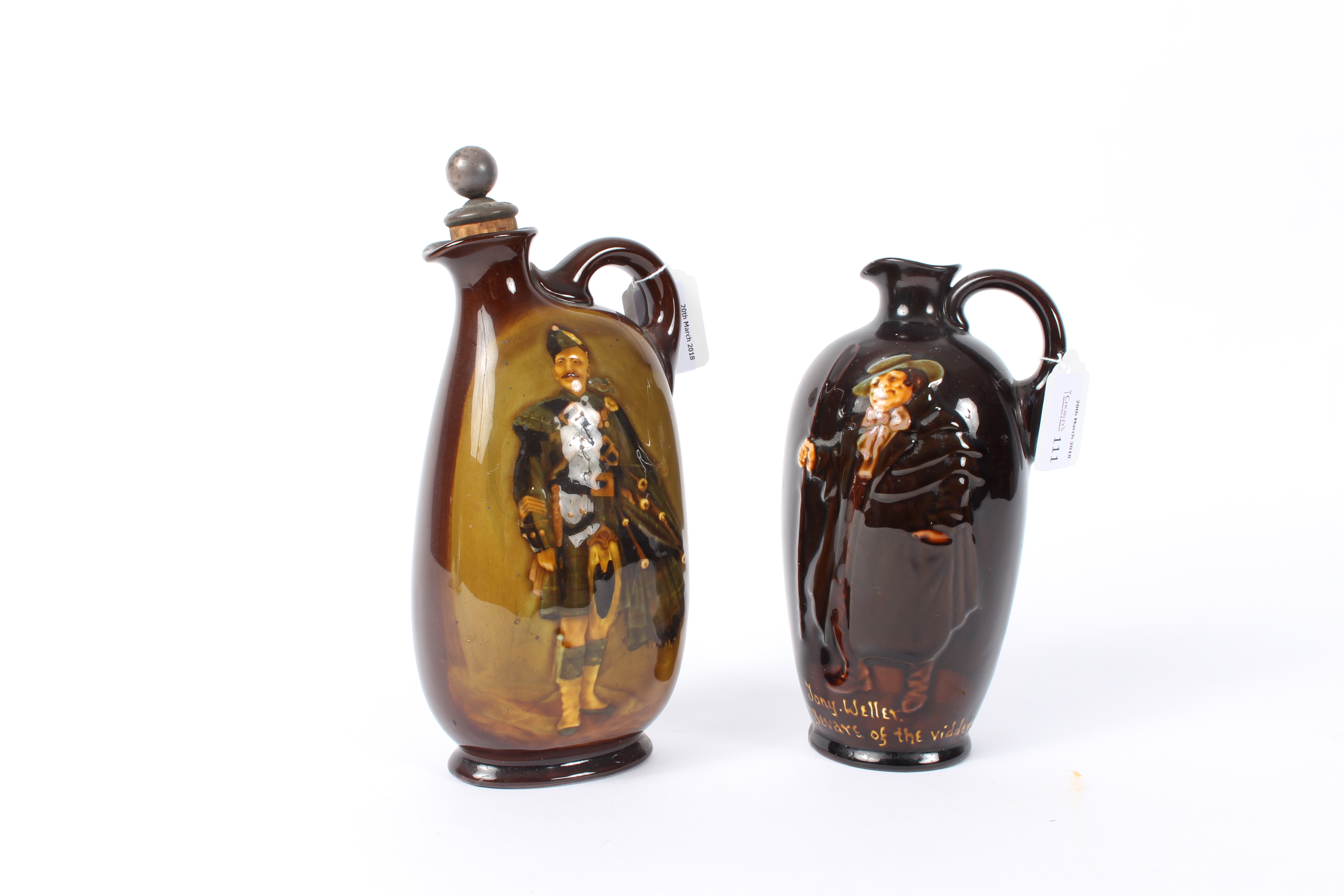 Two Royal Doulton Dewar's whisky bottles, each decorated a figure,