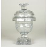 A small Irish glass lidded jar, honeycomb-type cutting,