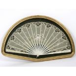 A late 19th Century painted French fan with lace leaf and ivory sticks and guards,