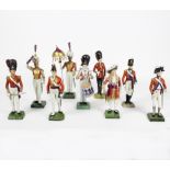 Nine German porcelain figures of guardsmen, including Tambourine 1st Guards, Drummer 1832,
