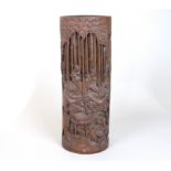 A Chinese carved bamboo brush pot, late 19th Century, carved figures in a bamboo forest,