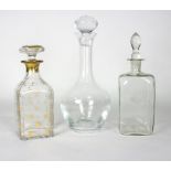 A group of glassware comprising three decanters, a comport, a goblet,