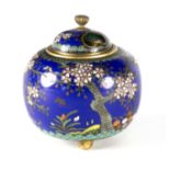 A Japanese blue ground cloisonné koro, Meiji period, with pierced cover and on three low feet,