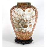 A Japanese Kutani porcelain jar, Meiji period, of ovoid form decorated reserves of fish,