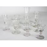 Seven Georgian drinking glasses with faceted bowls, various sizes,