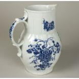 A Caughley blue and white cabbage-leaf moulded jug, circa 1780, printed with flowers, mask spout,