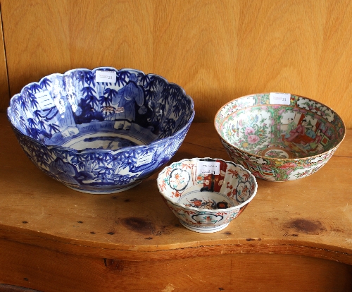 A late 19th Century Japanese Imari bowl, painted reserves of flowers with scalloped border,