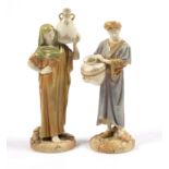 A pair of Royal Worcester figures of 'Cairo Water Carriers', modelled by James Hadley, shape no.