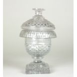 A small Irish glass lidded jar, cut with diamonds,