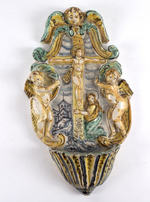 A 18th Century Italian polychrome majolica Holy water stoop, moulded with a crucifix,