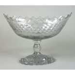 An Irish glass pedestal bowl, navette shaped bowl cut with a band of diamonds above swags,