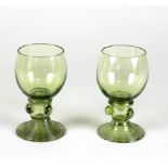 Two green glass roemers, perhaps English circa 1820, each with raspberry prunts and threaded foot,