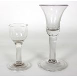 An 18th Century wine glass with drawn trumpet bowl, plain stem and folded foot, 16.