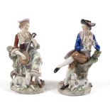 A pair of Sitzendorf porcelain figures of musicians, each approximately 21cm high,