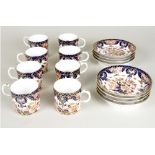 Eight Derby Imari coffee cans and saucers