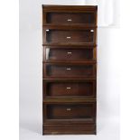 A Globe Wernicke mahogany sectional bookcase of six glazed stacking shelves,