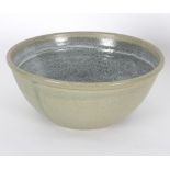 Russell Collins (British, born 1942)/Large stoneware bowl/in a pale green glaze,